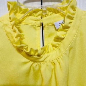 CUTE CALVIN KLEIN YELLOW RUFFED NECK TOP YOU ARE GOING TO LOVE. LIKE NEW & CUTE.